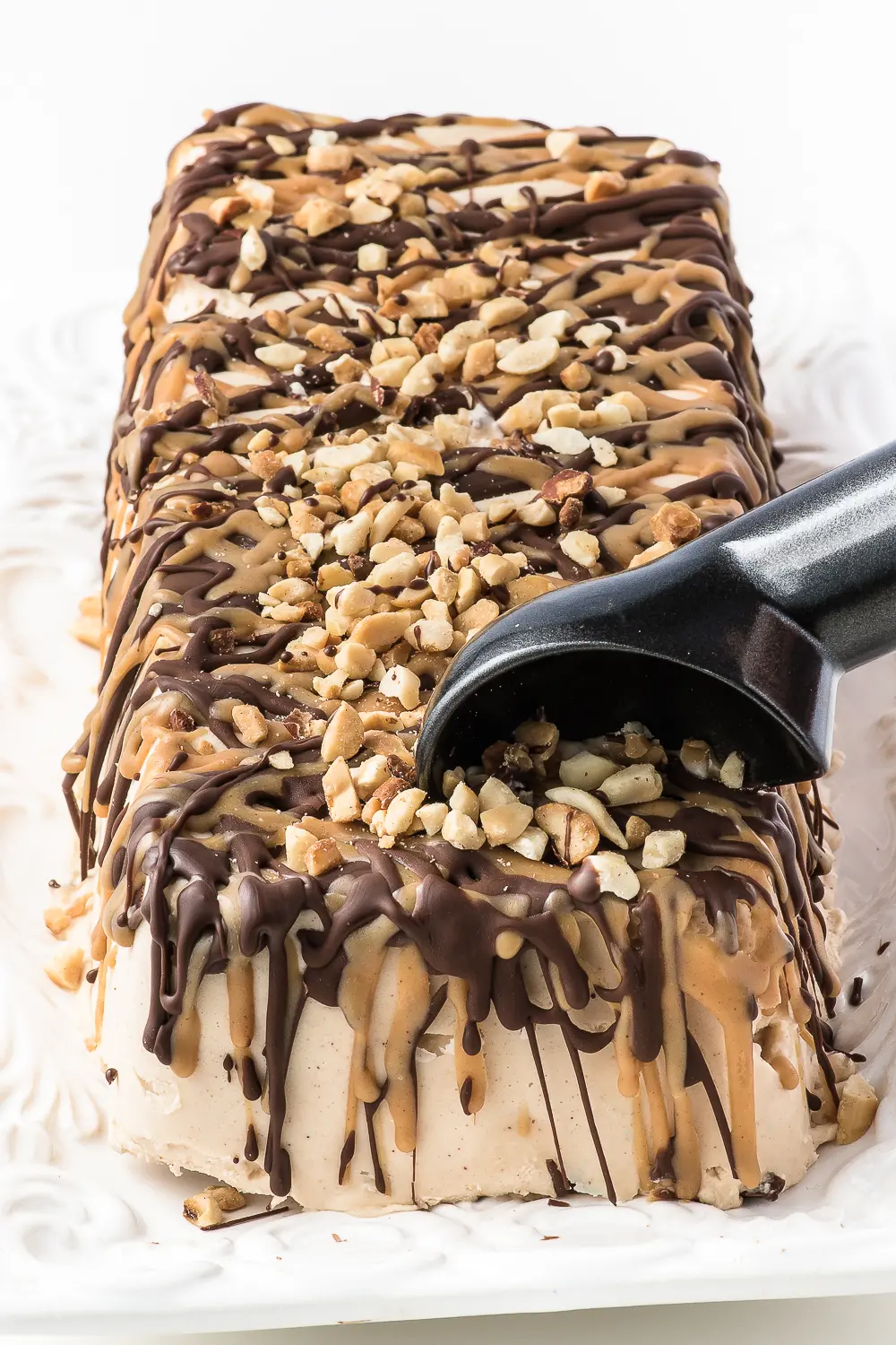 loaf shaped ice cream cake with chocolate and peanut butter drizzle