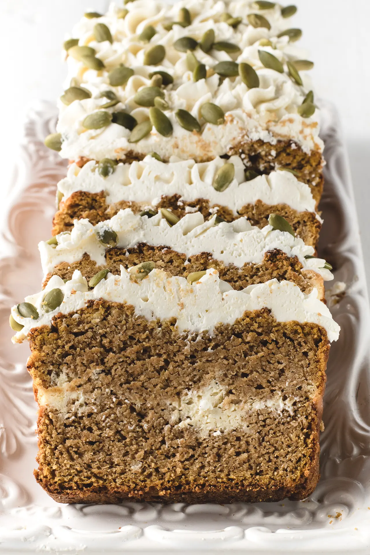 Slices of low carb pumpkin bread laid out on a serving tray.