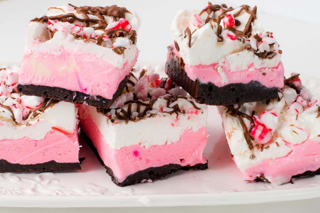 Peppermint ice cream bars lined up on a serving tray.