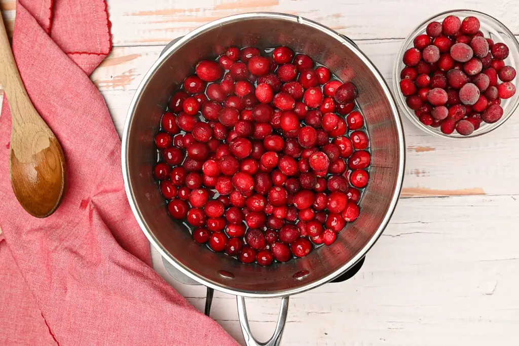 Fresh cranberries added to the pot.