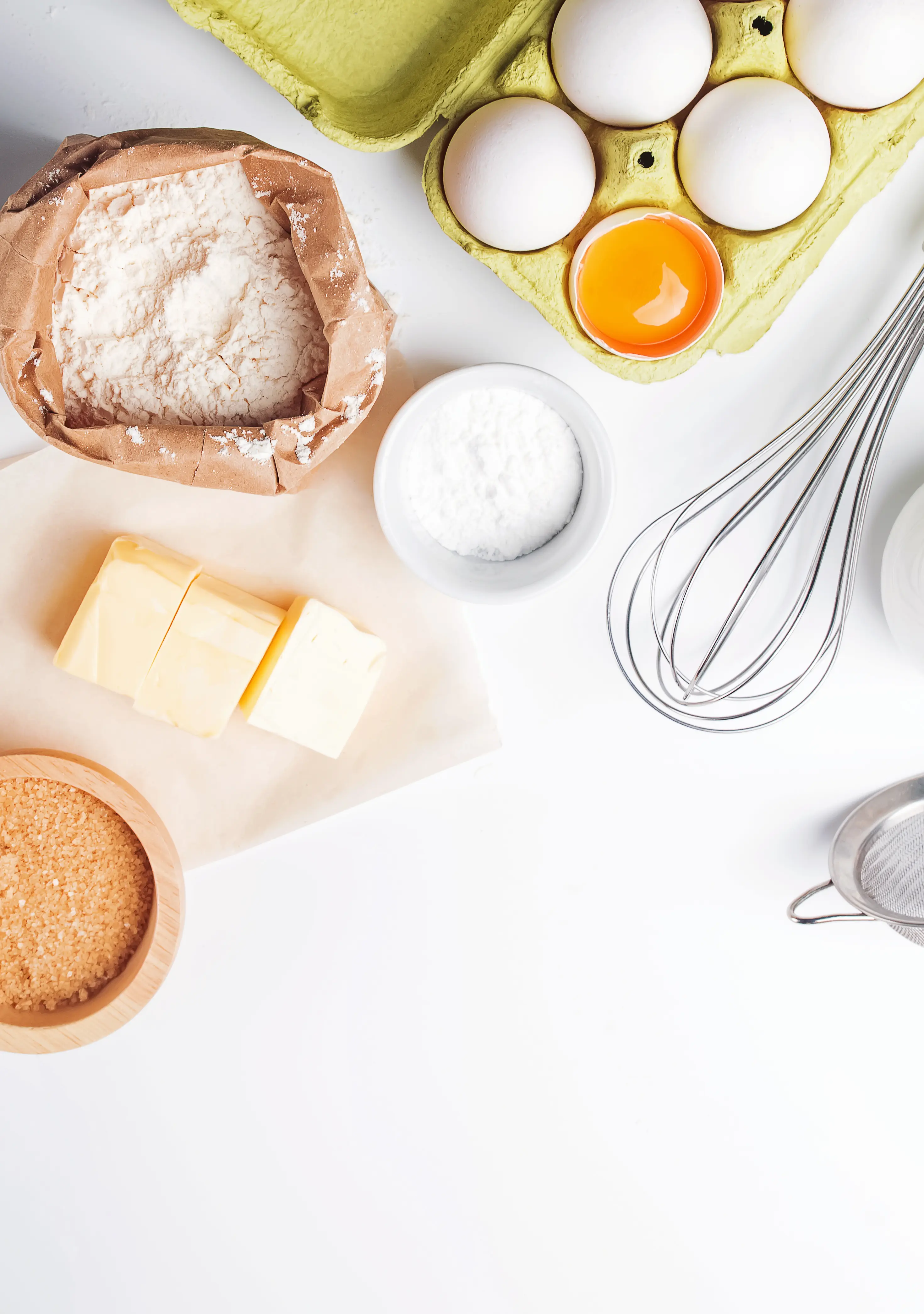 Baking ingredients on a bright white background. 